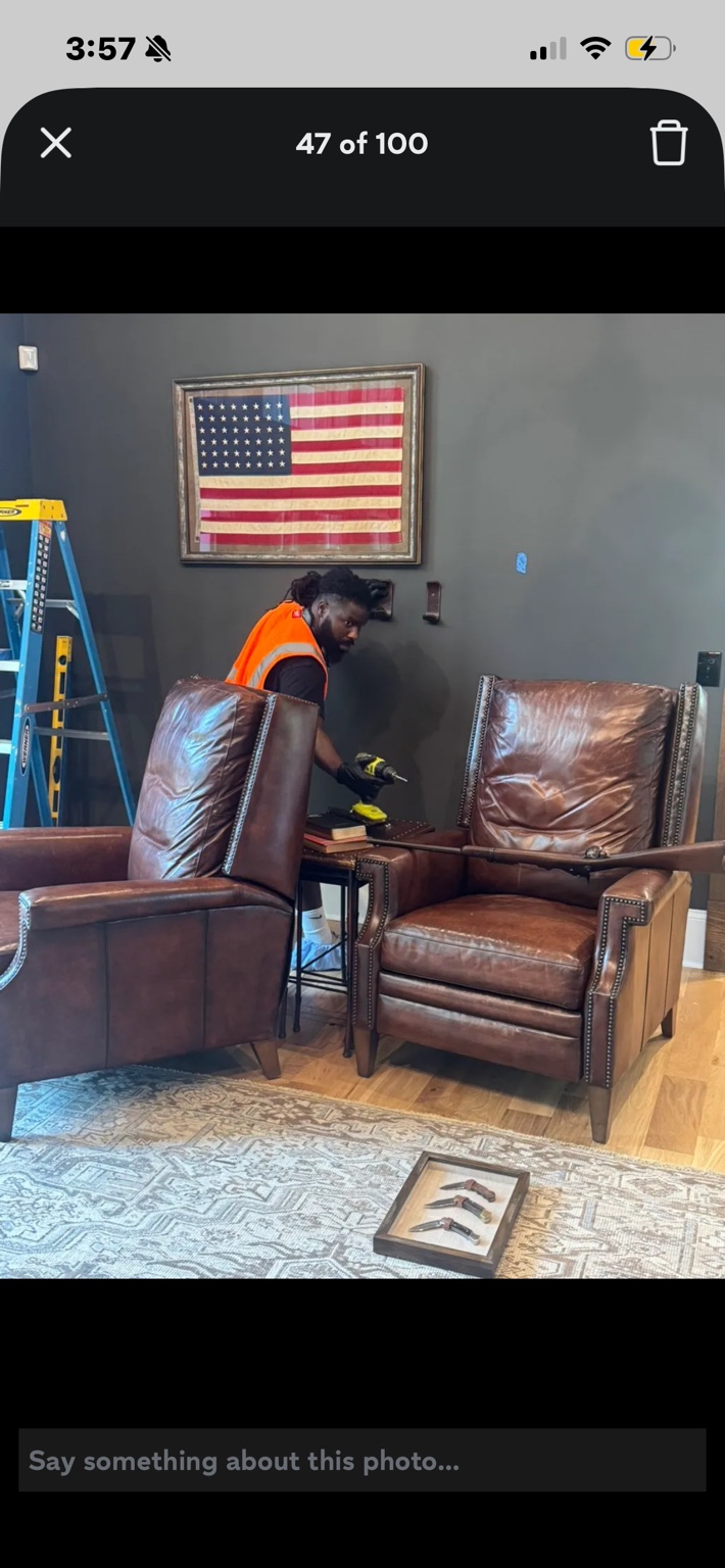 Devante completing an installation in a customer's home